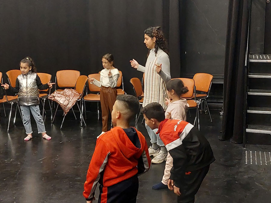 Theatre project at the Paley Center: teacher with children
